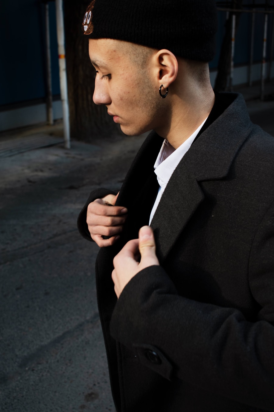Man in black jacket and hat