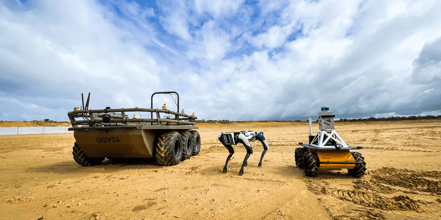 Three robots on sand