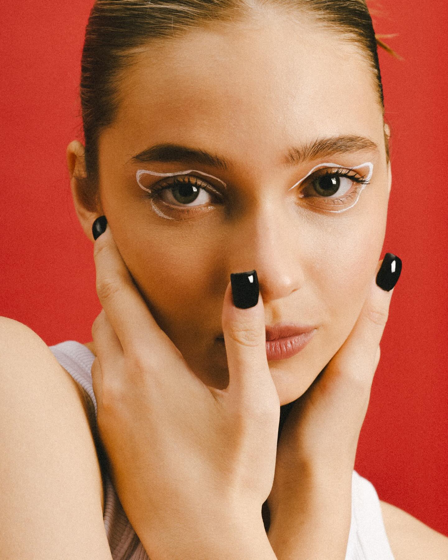 Fashion photoshoot with a woman posing in a dress