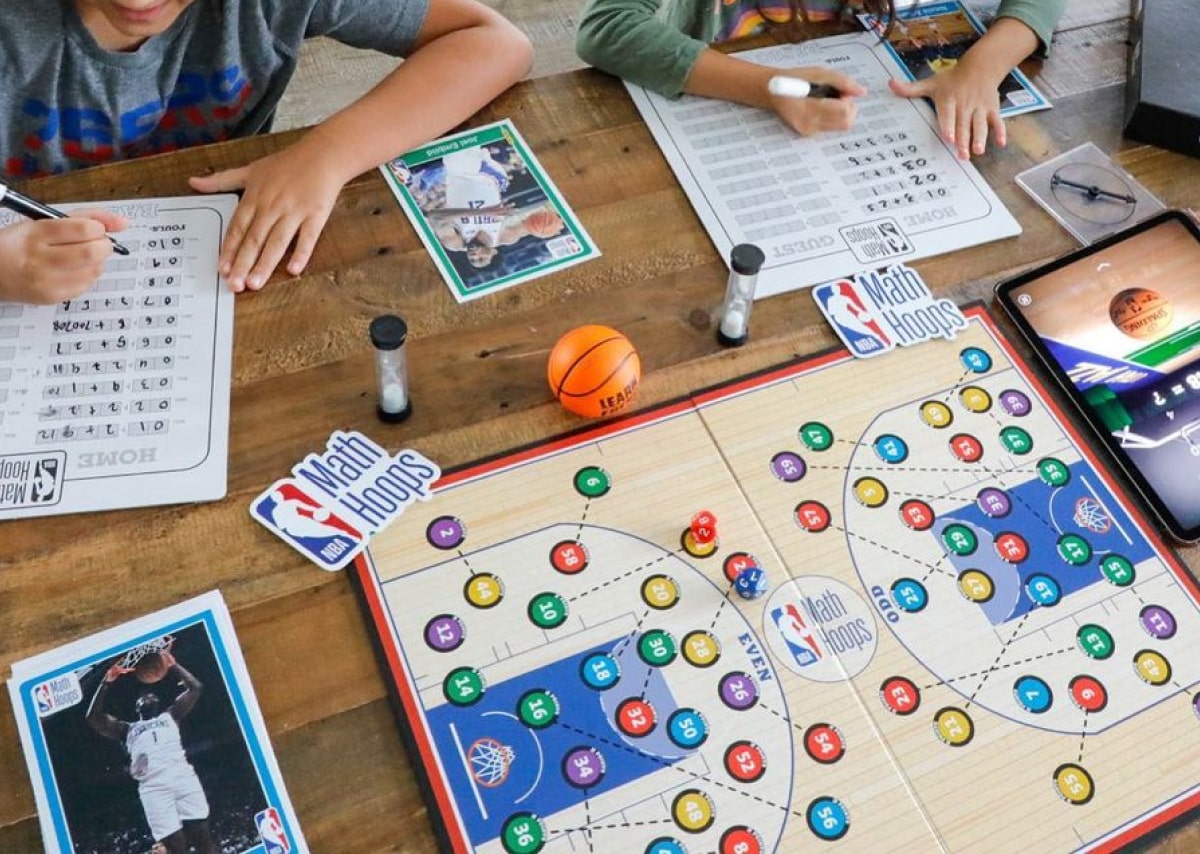 Kids playing NBA Math Hoops board game 1