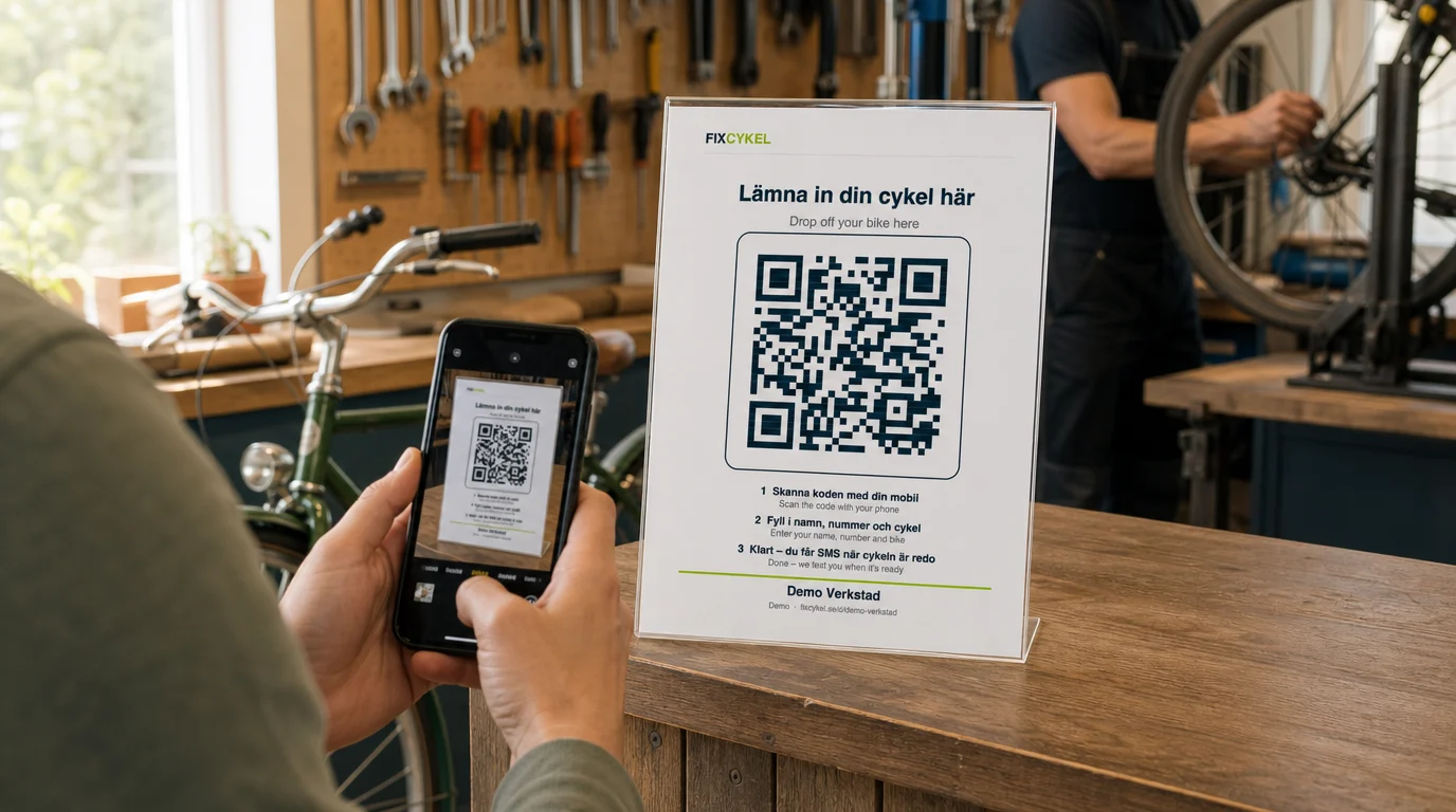A customer scans the Lämna in din cykel här QR sign on a workshop counter while the mechanic keeps working on a wheel behind