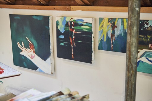 Monstera leaves with dappled sunlight on wall