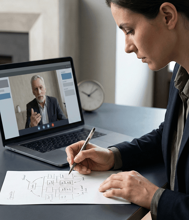 three men laughing while looking in the laptop inside room