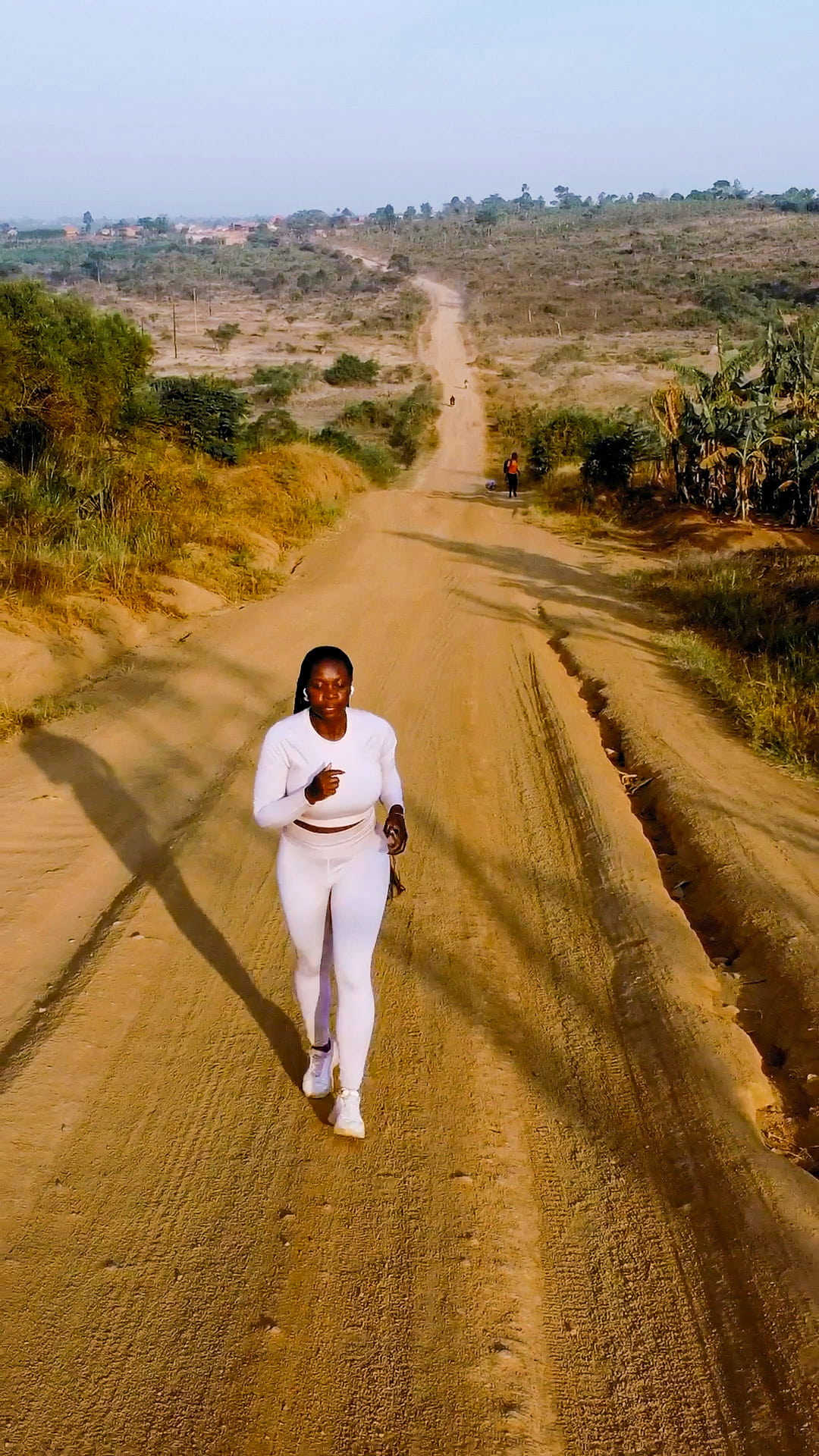 Mary Consolata Namagambe takes a jog down a dusty road in Uganda