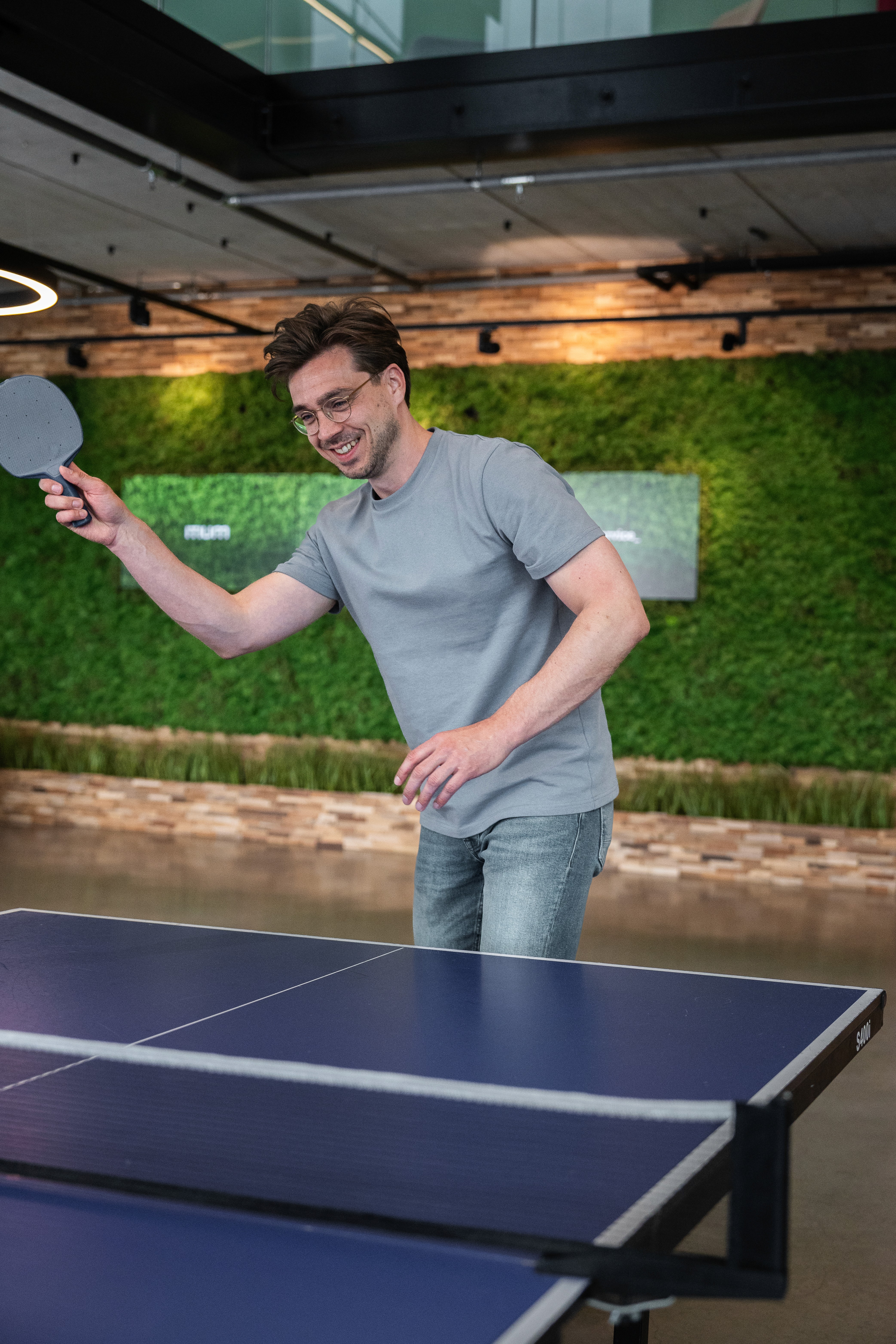 a desk with a computer and speakers on it