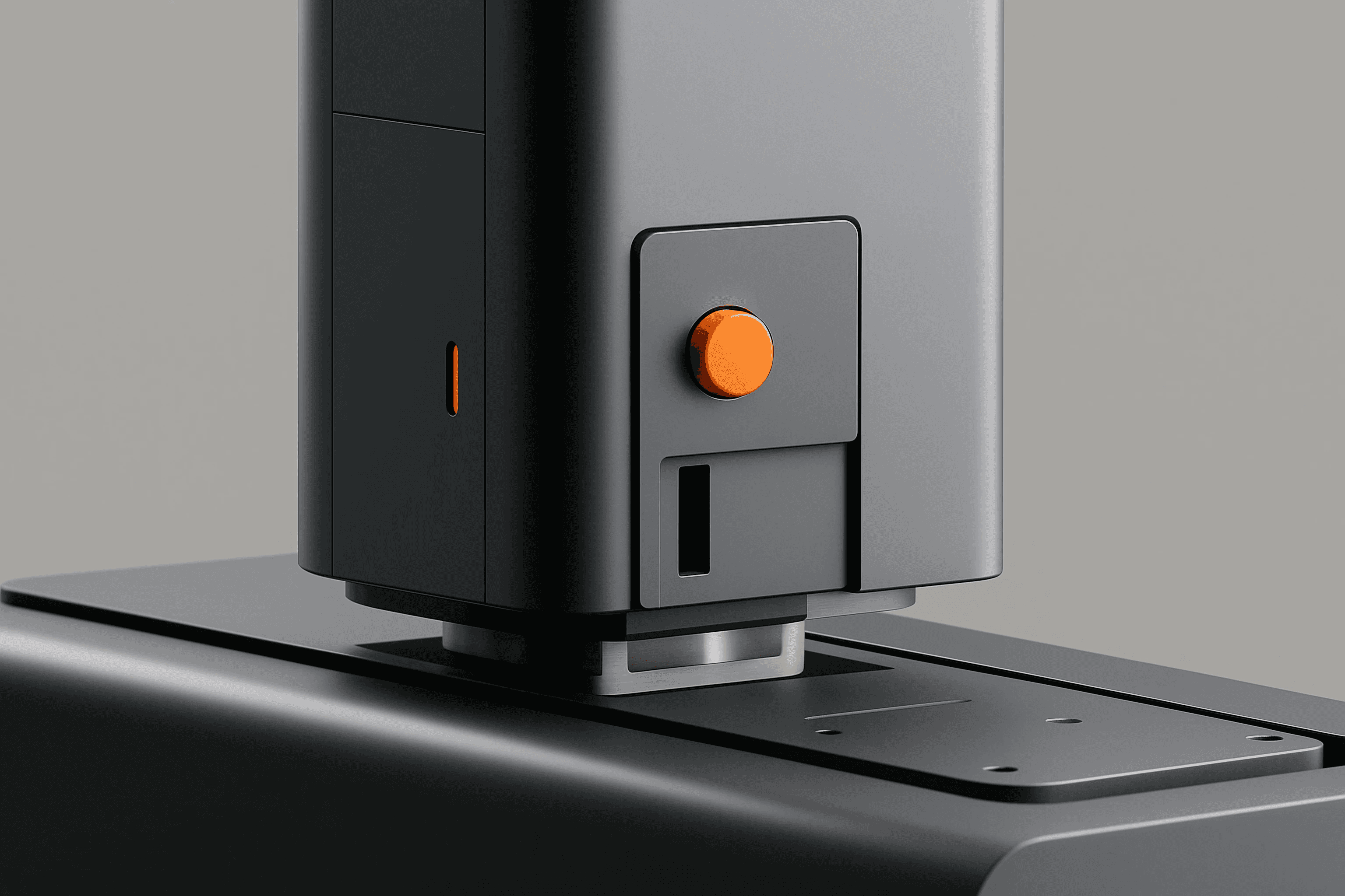 Close up of grey industrial machine with orange control button