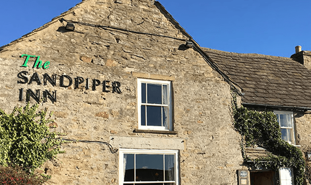 The Sandpiper Inn traditional Yorkshire stone pub with rustic facade and country charm, historic dining establishment