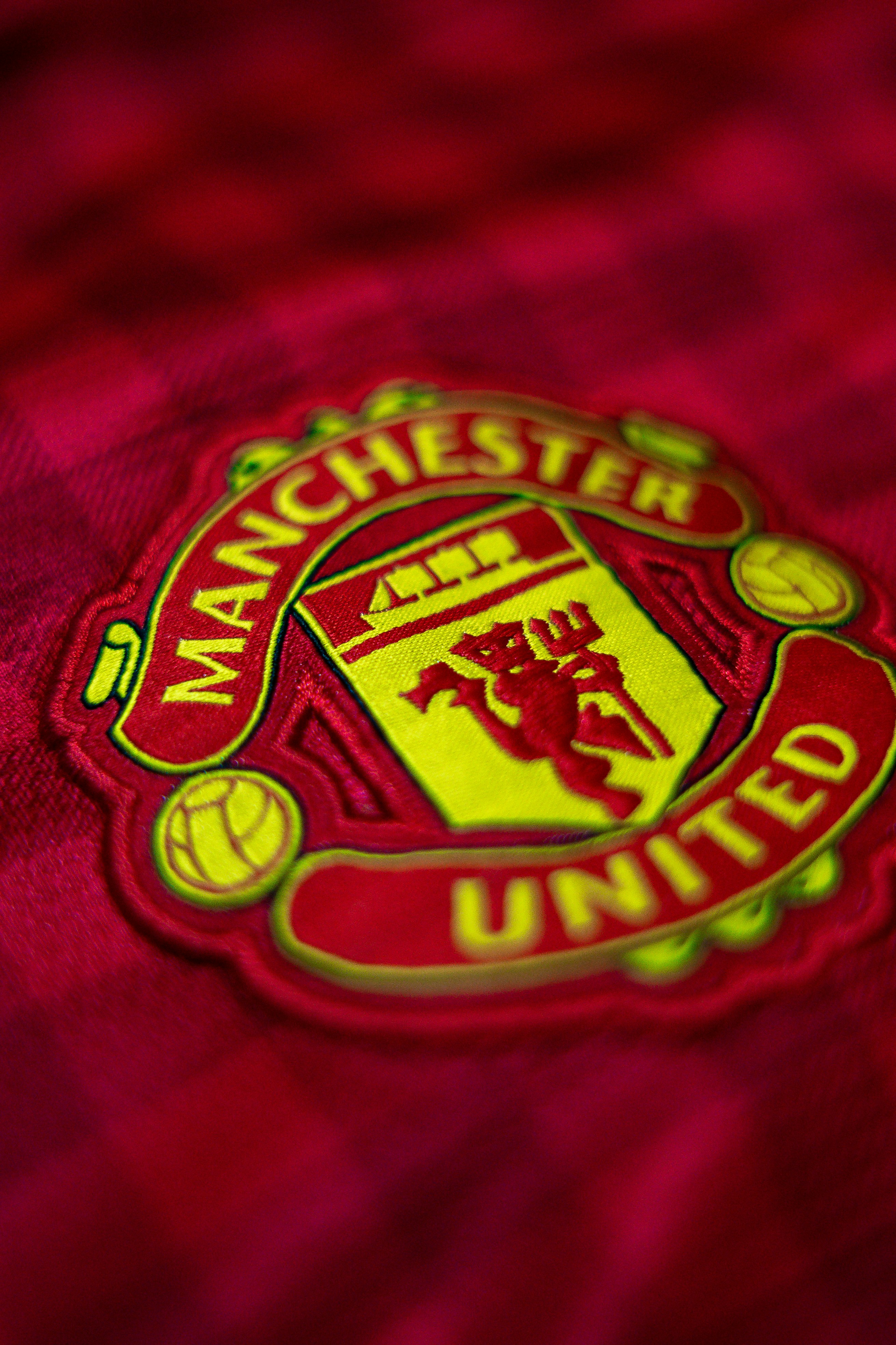 red and yellow Manchester United textile