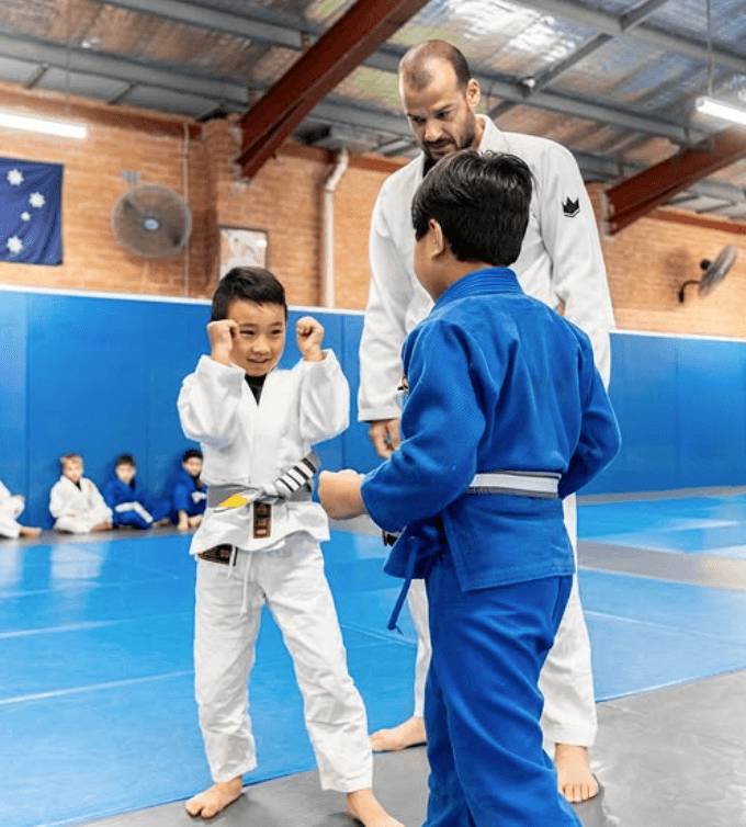  Instructor guiding a group of students during Jiu Jitsu class