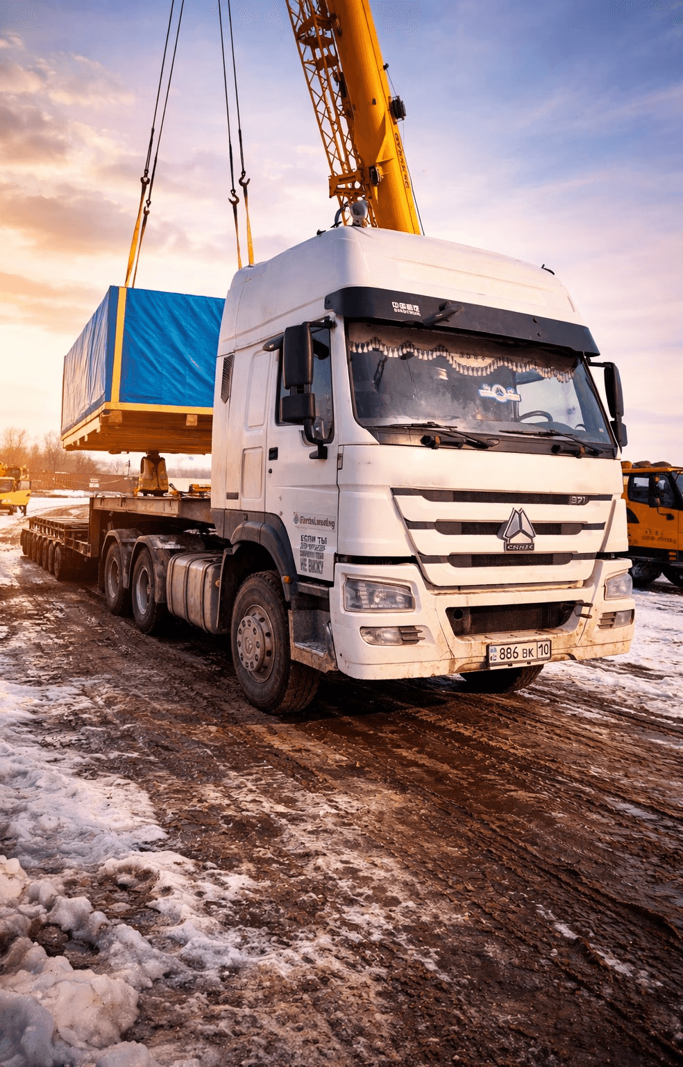 Man sitting in a car next toboxes