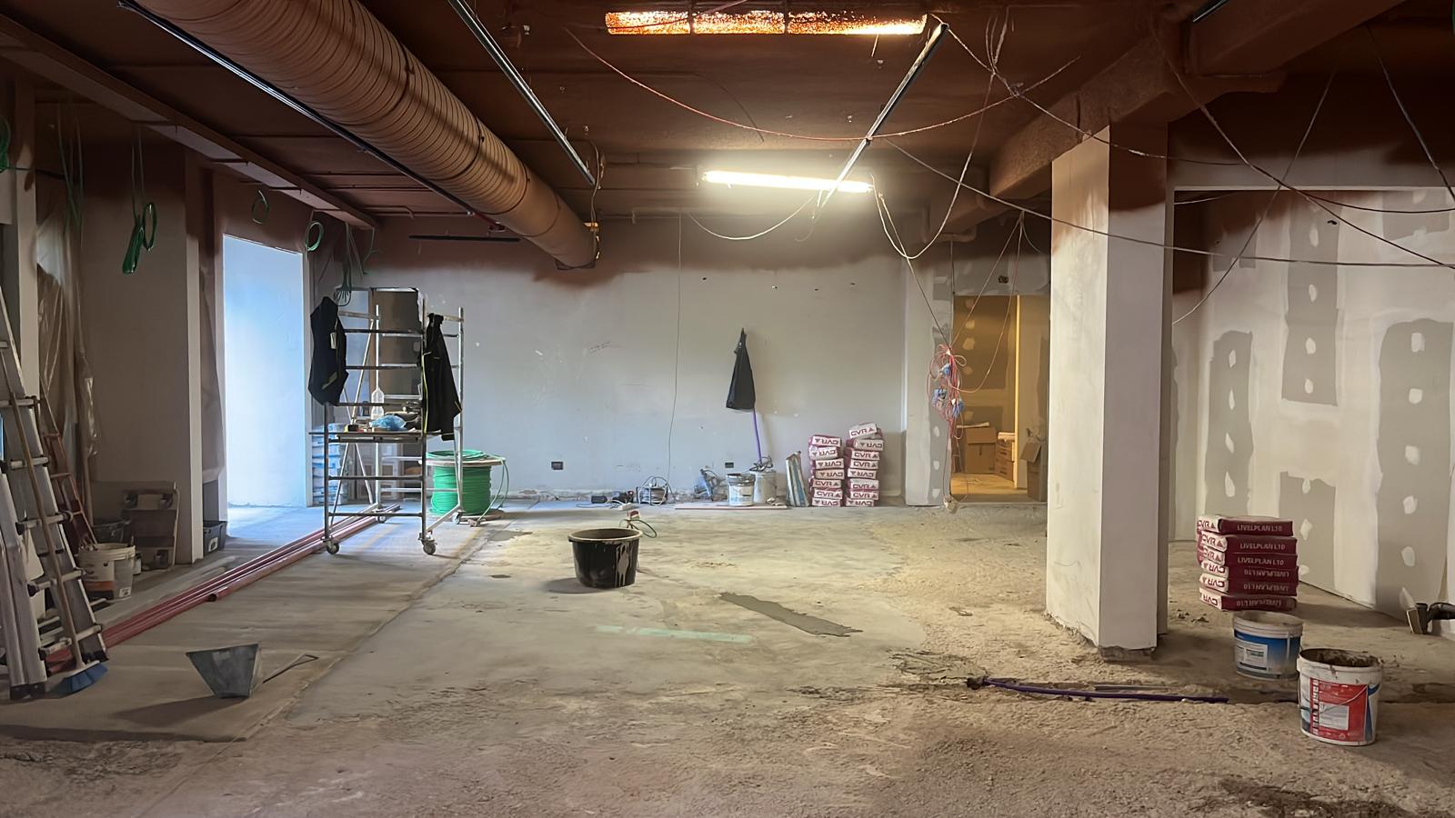 A man laying on the floor in a room