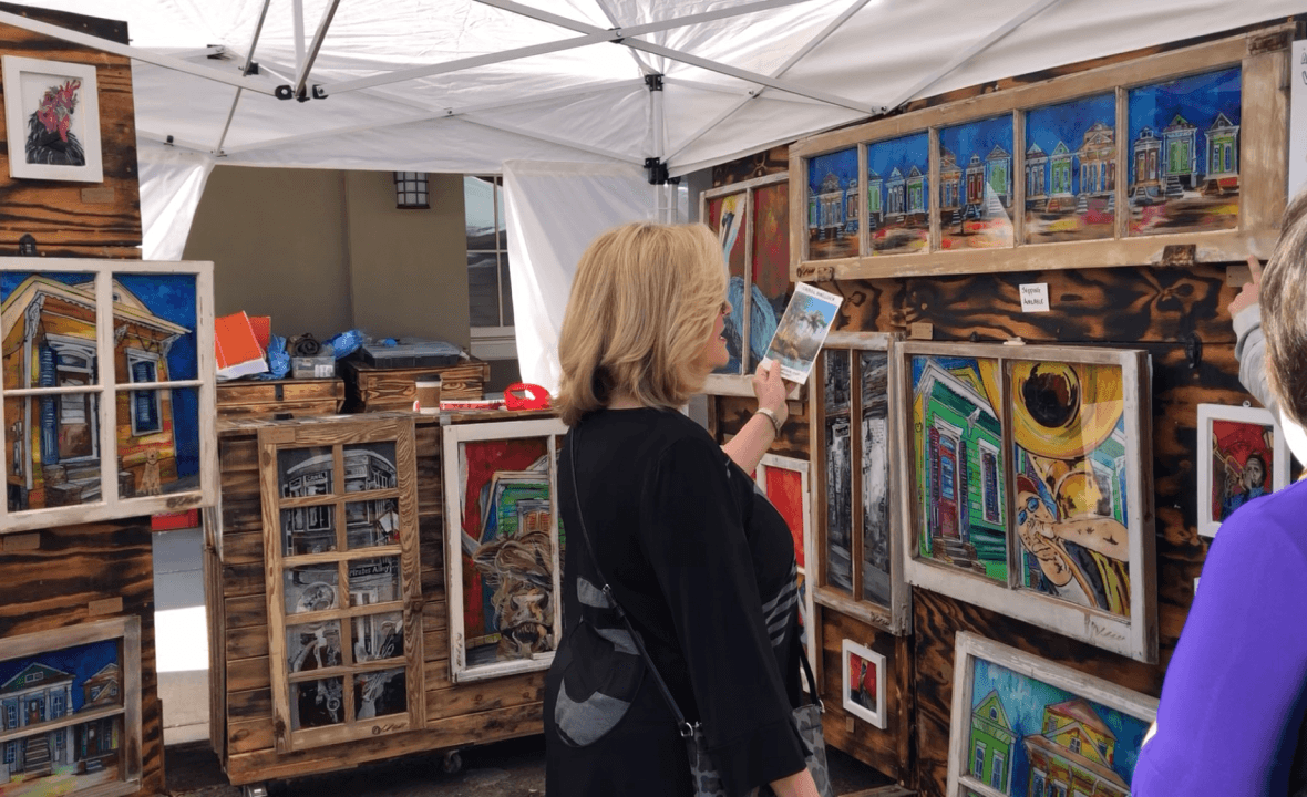 Woman shopping for art at the Three Rivers Art Festival in Covington Louisiana