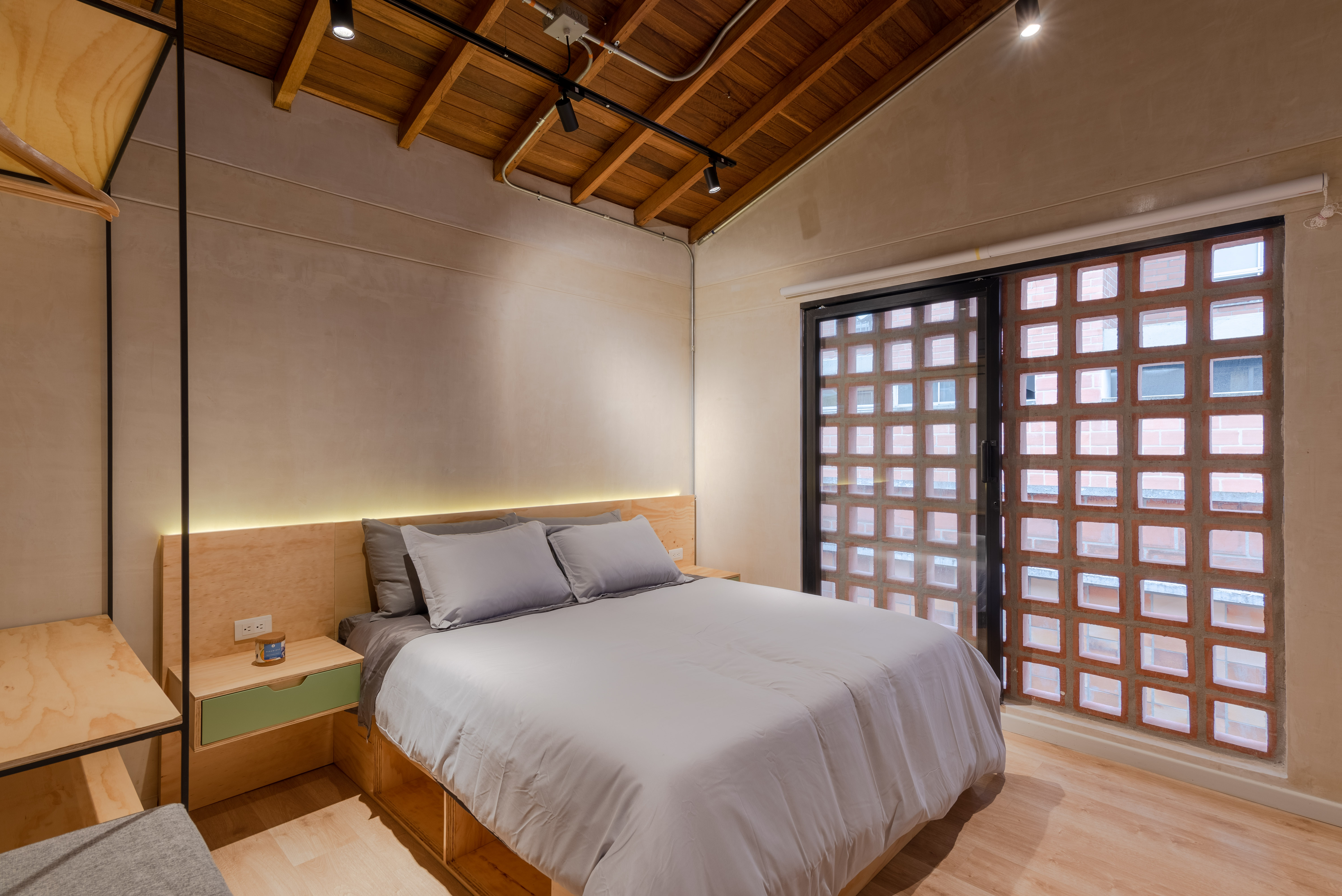 Double-height interior with flowing sculptural forms and warm raking light