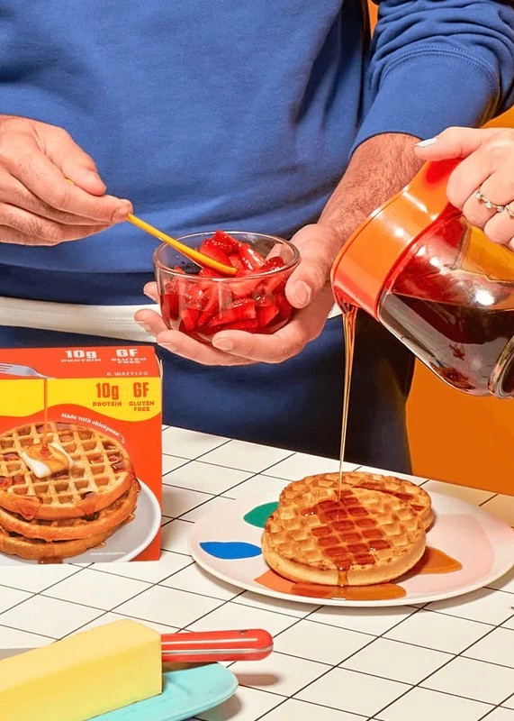 Syrup pouring onto Banza waffles