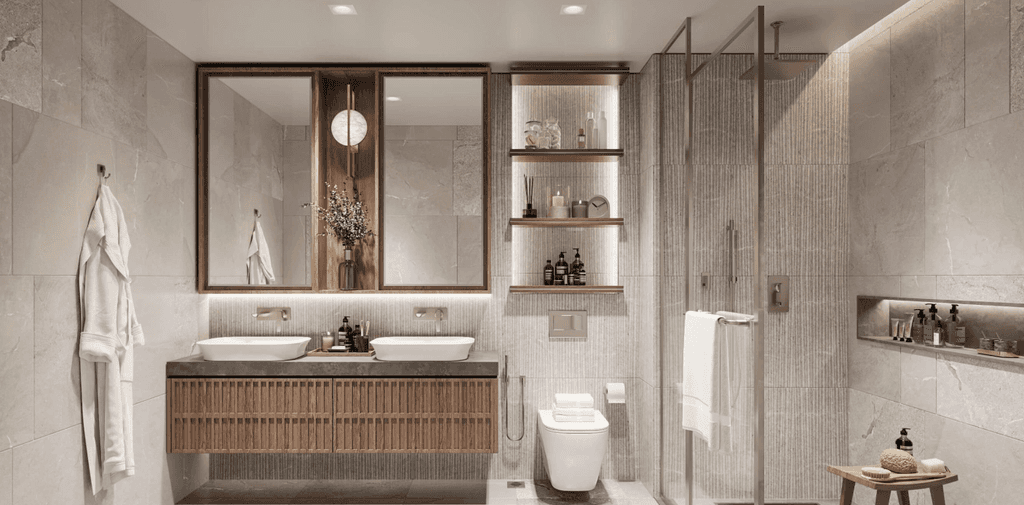 A modern bathroom featuring a sink, toilet, and shower, designed with sleek lines and contemporary finishes at The Crestmark.