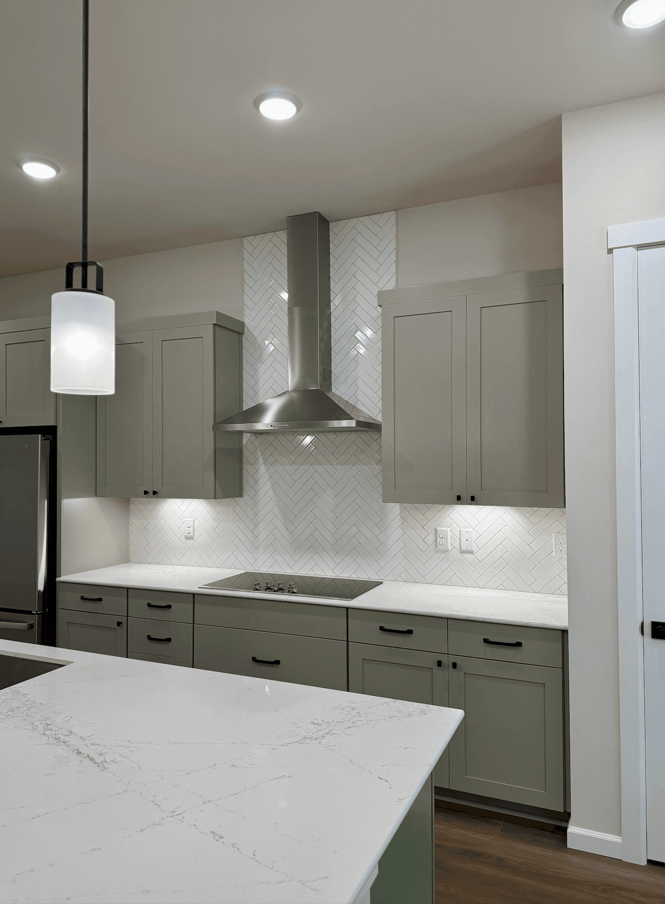 Custom geometric tile backsplash installation