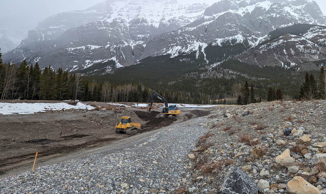Winter construction work restoring sediment trap capacity on Evan Thomas Creek before spring freshet