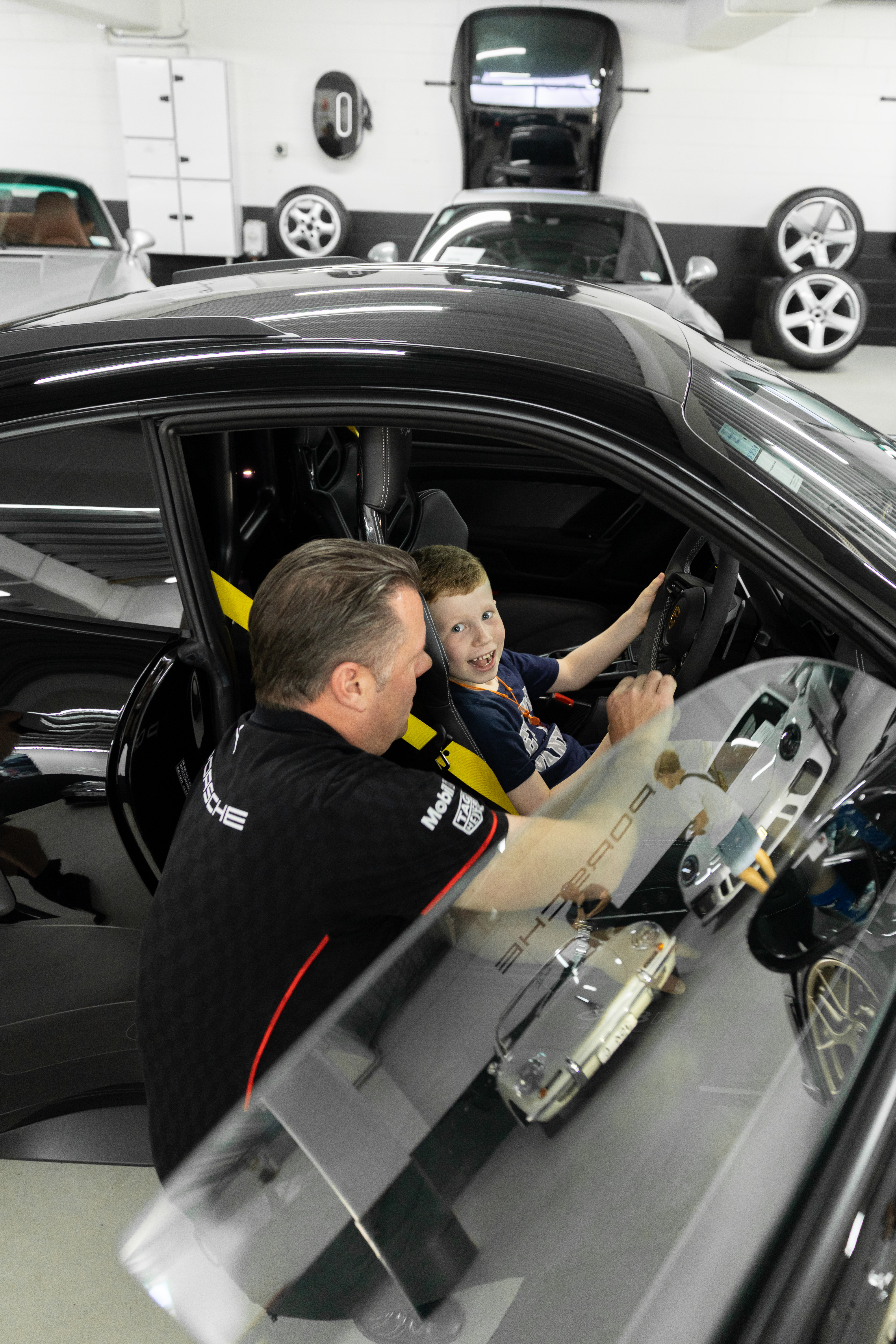 Streetside billboard with flyposters of the Batch.Works brand and illustrations