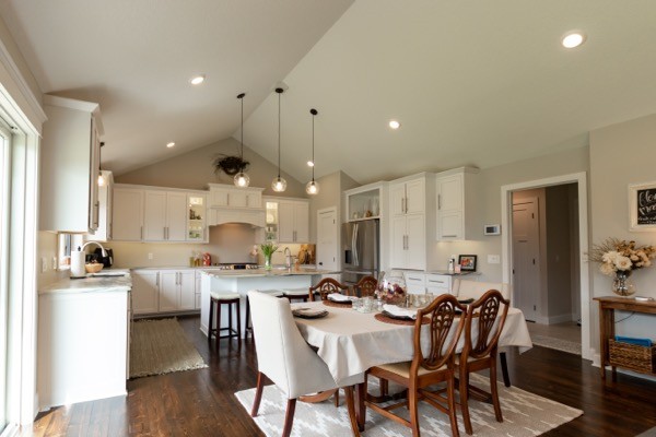 Vaulted dining room white cabinets dark wood floors