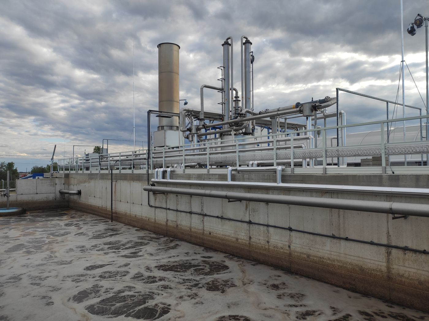 Aerated CYCLATOR basin with biogas equipment behind at the Agrosprint plant, Karcag, Hungary