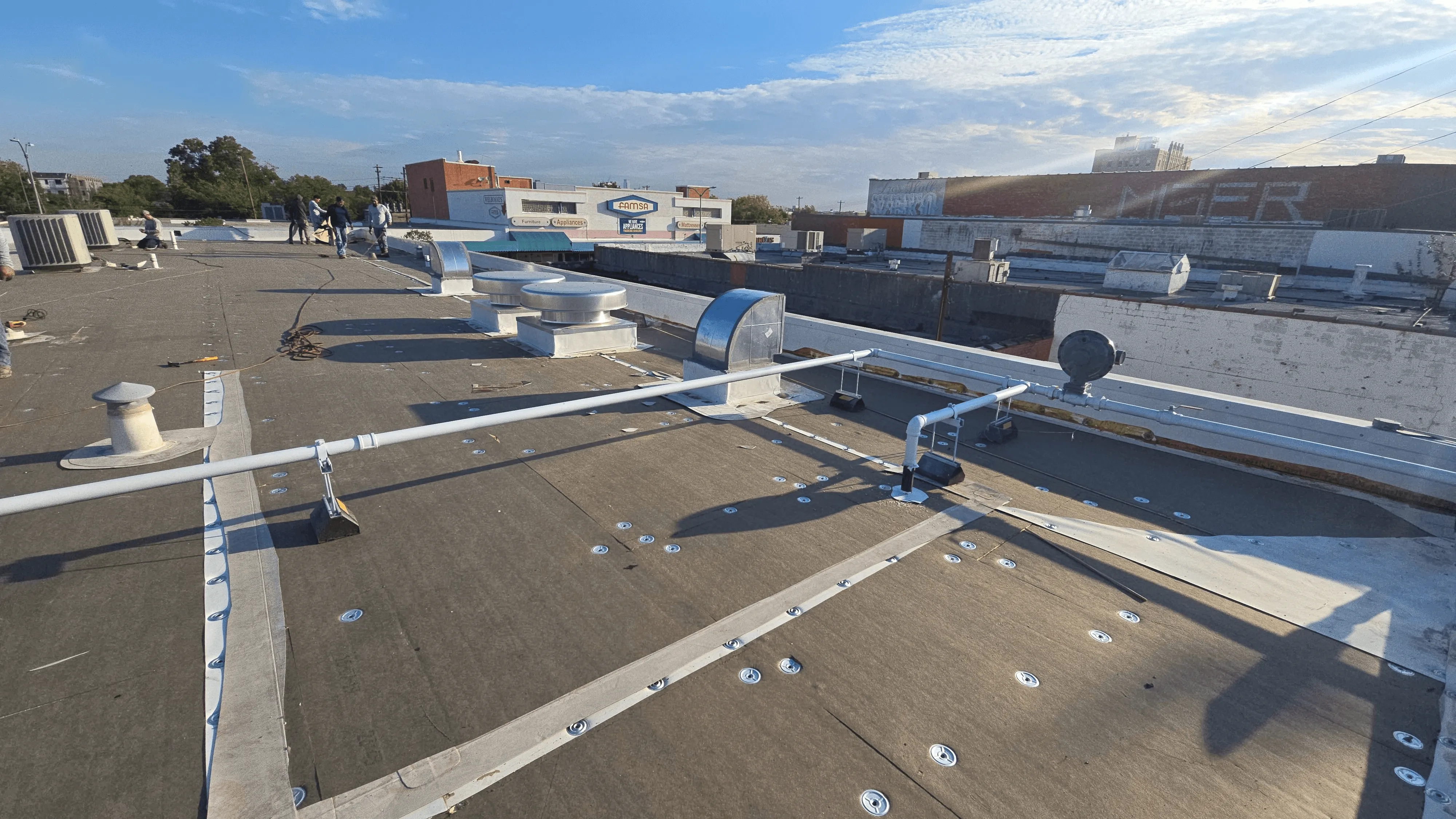 work in progress commercial roofing project in dallas texas by arrington roofing contractor