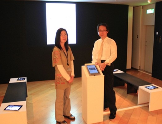 image of a man and a woman in an exhibition gallery