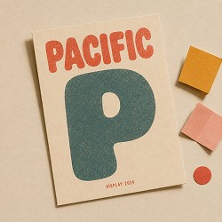Poster with bold text "PACIFIC" in red-orange and a large stylized "P" in teal, accompanied by small colored paper pieces on a beige background.
