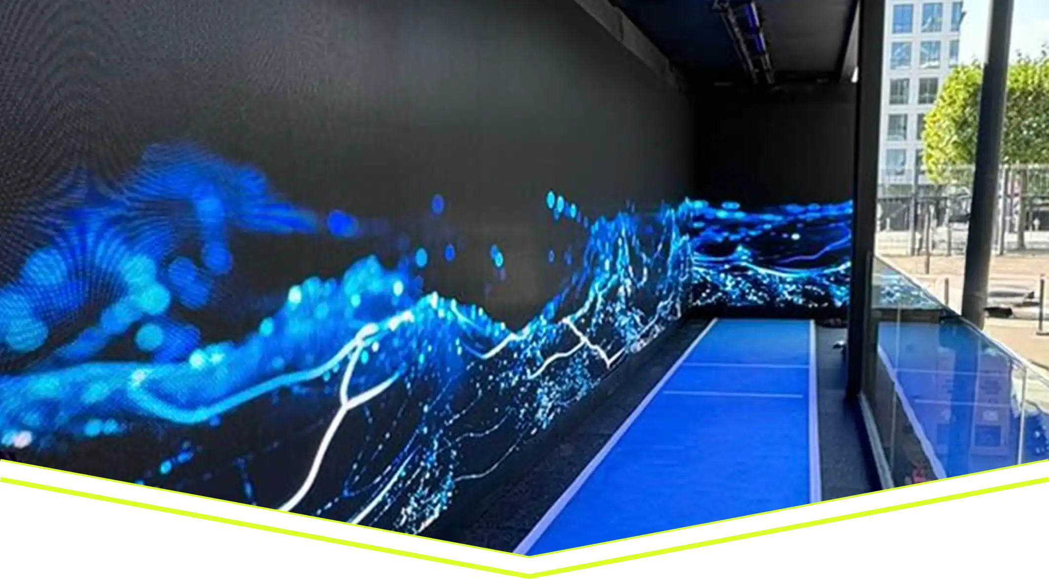 Large-format LED display installed along a commercial venue walkway