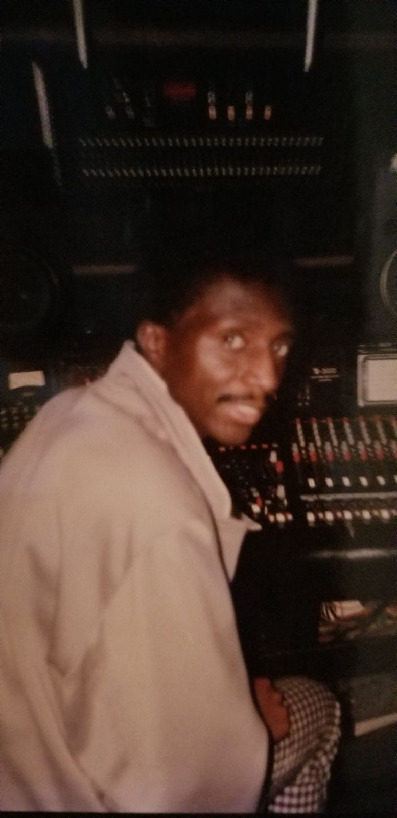 Music producer sitting in his studio