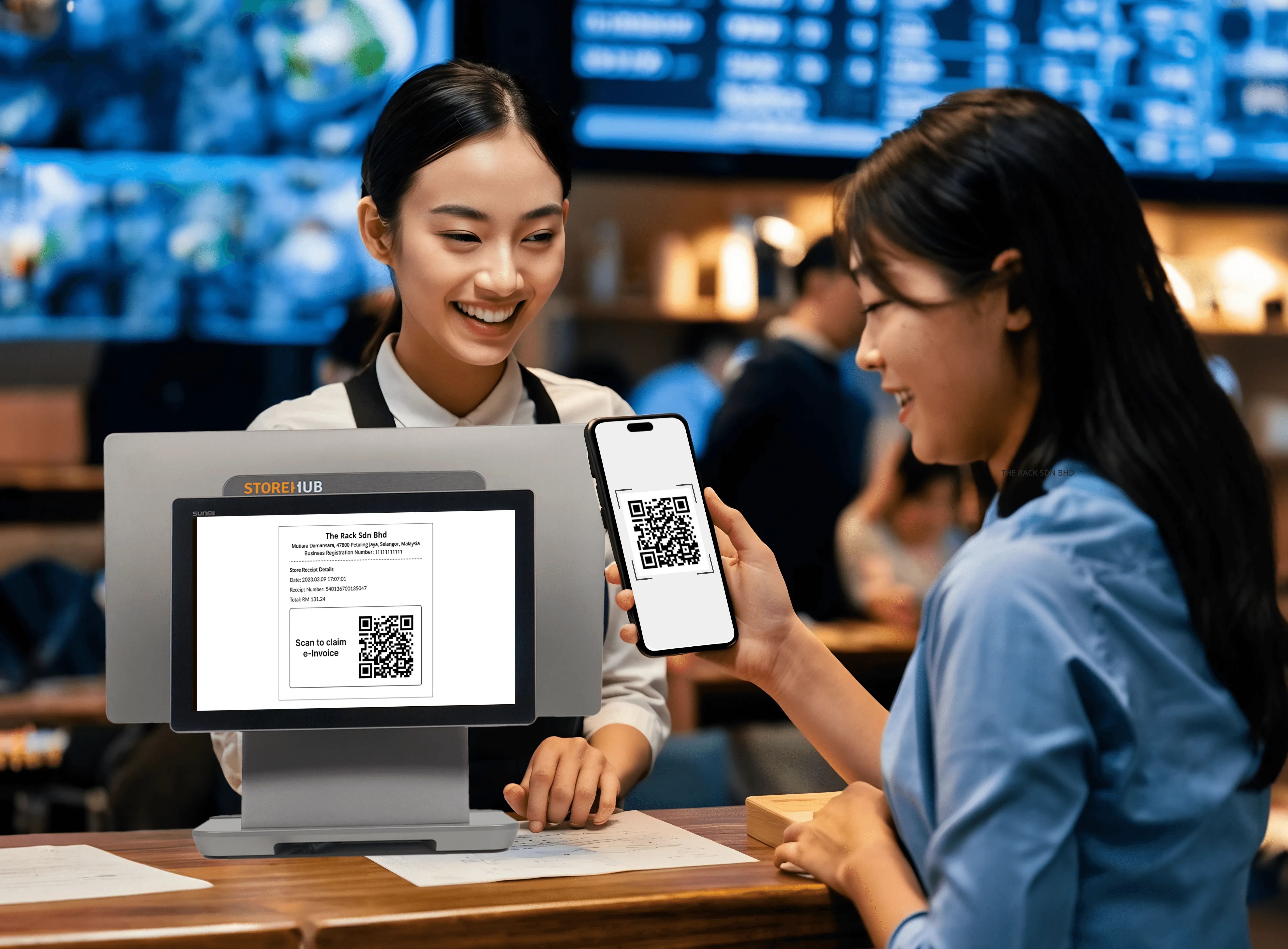 Malaysian customer scanning QR code to receive LHDN-compliant digital e-Invoice from StoreHub POS system.