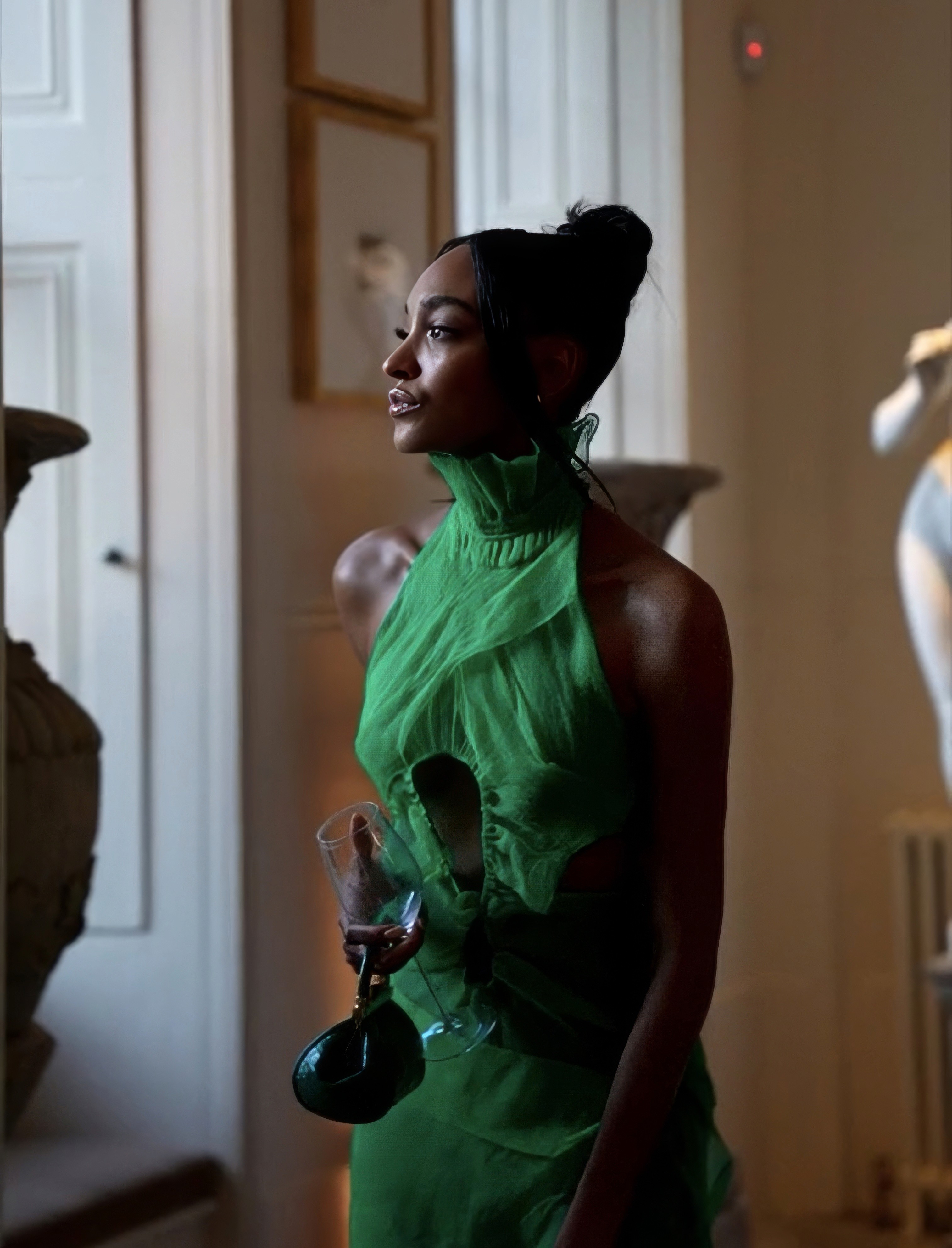 Bride and groom walking on street at night