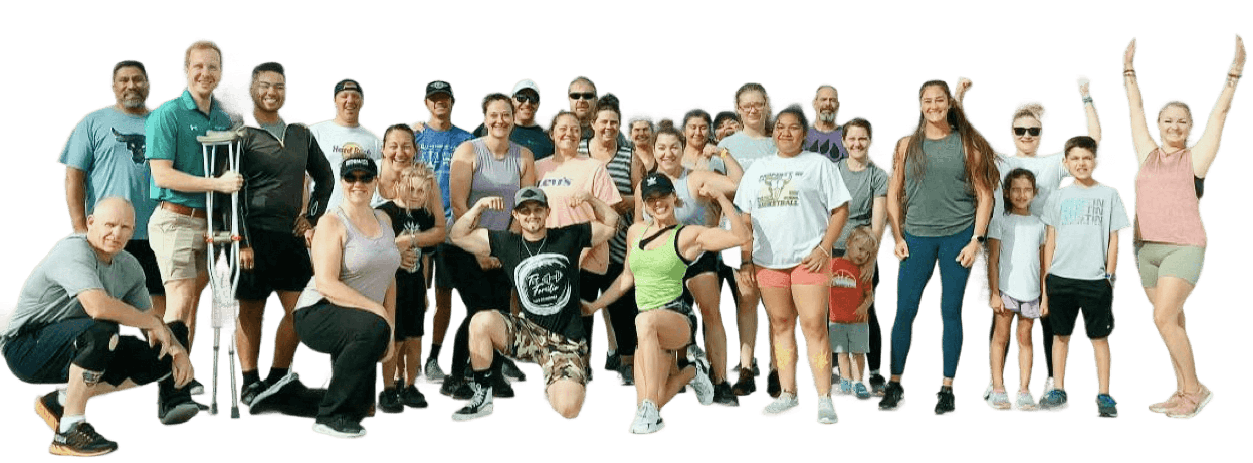 Large diverse group of people posing for a photo. Some are flexing muscles, others smiling with arms raised.