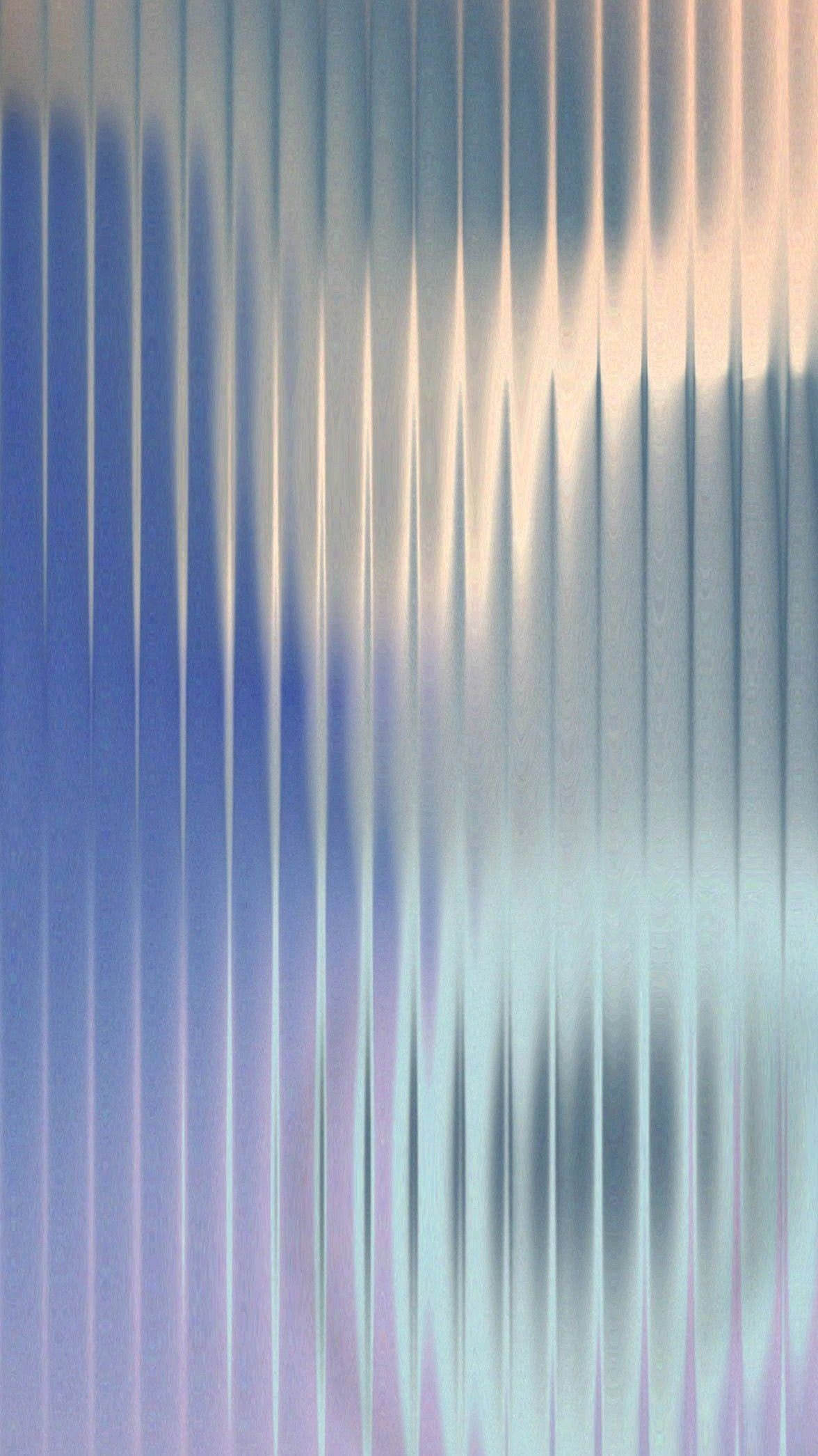 a blurry photo of a person standing in front of a wall