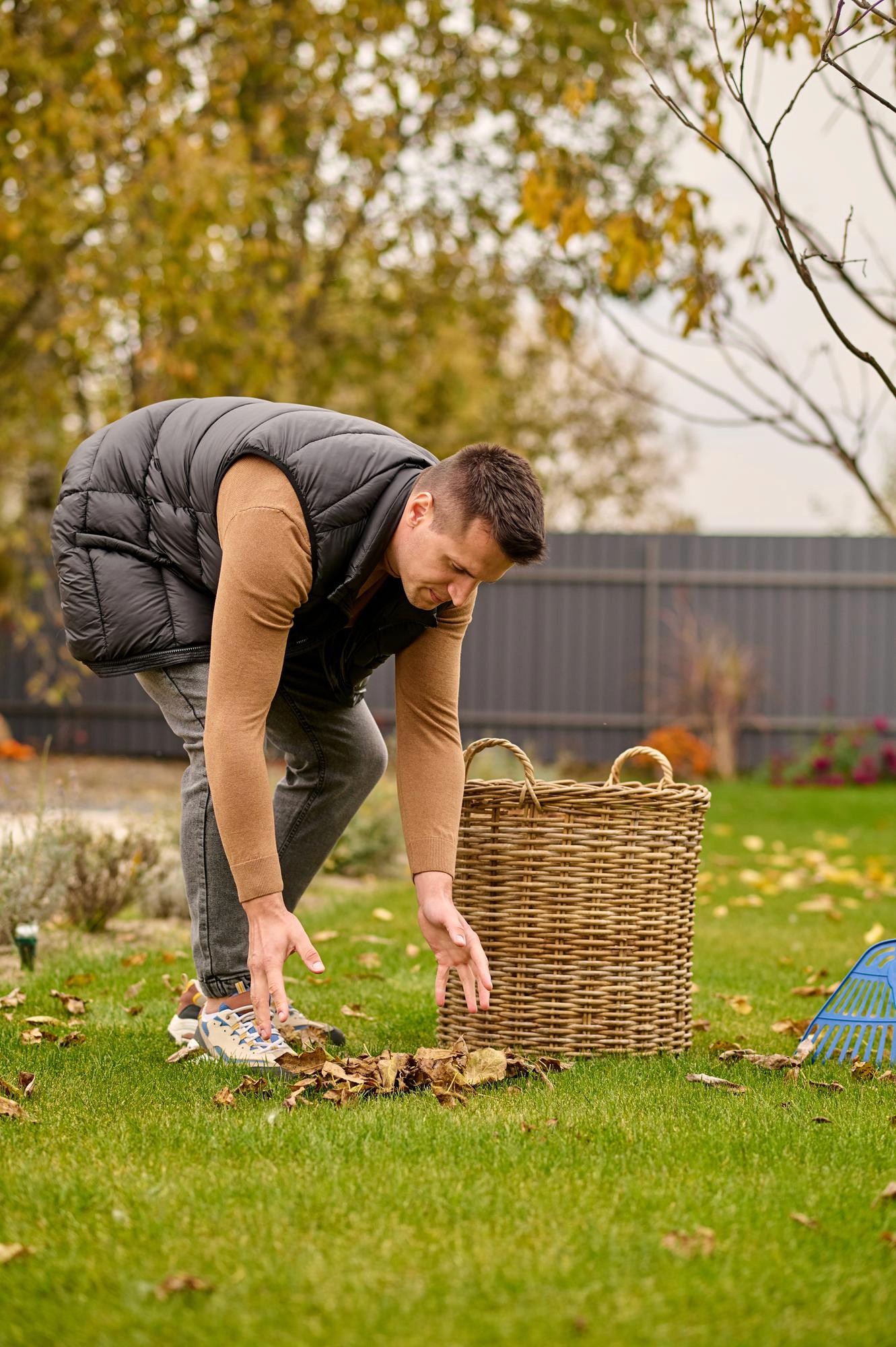 A backyard compost bin with a mix of kitchen scraps and yard waste