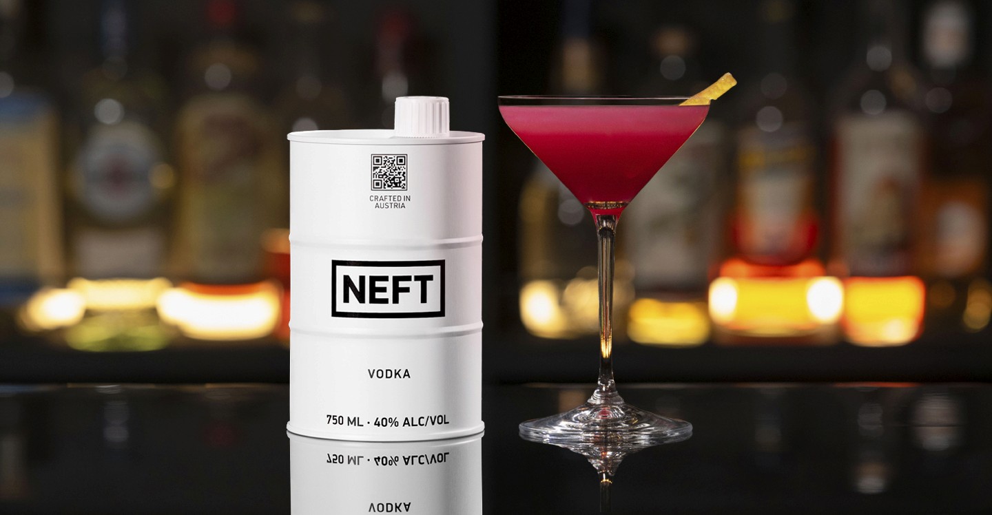 A NEFT Barrel and a glass of Empress Wu on a bar counter.