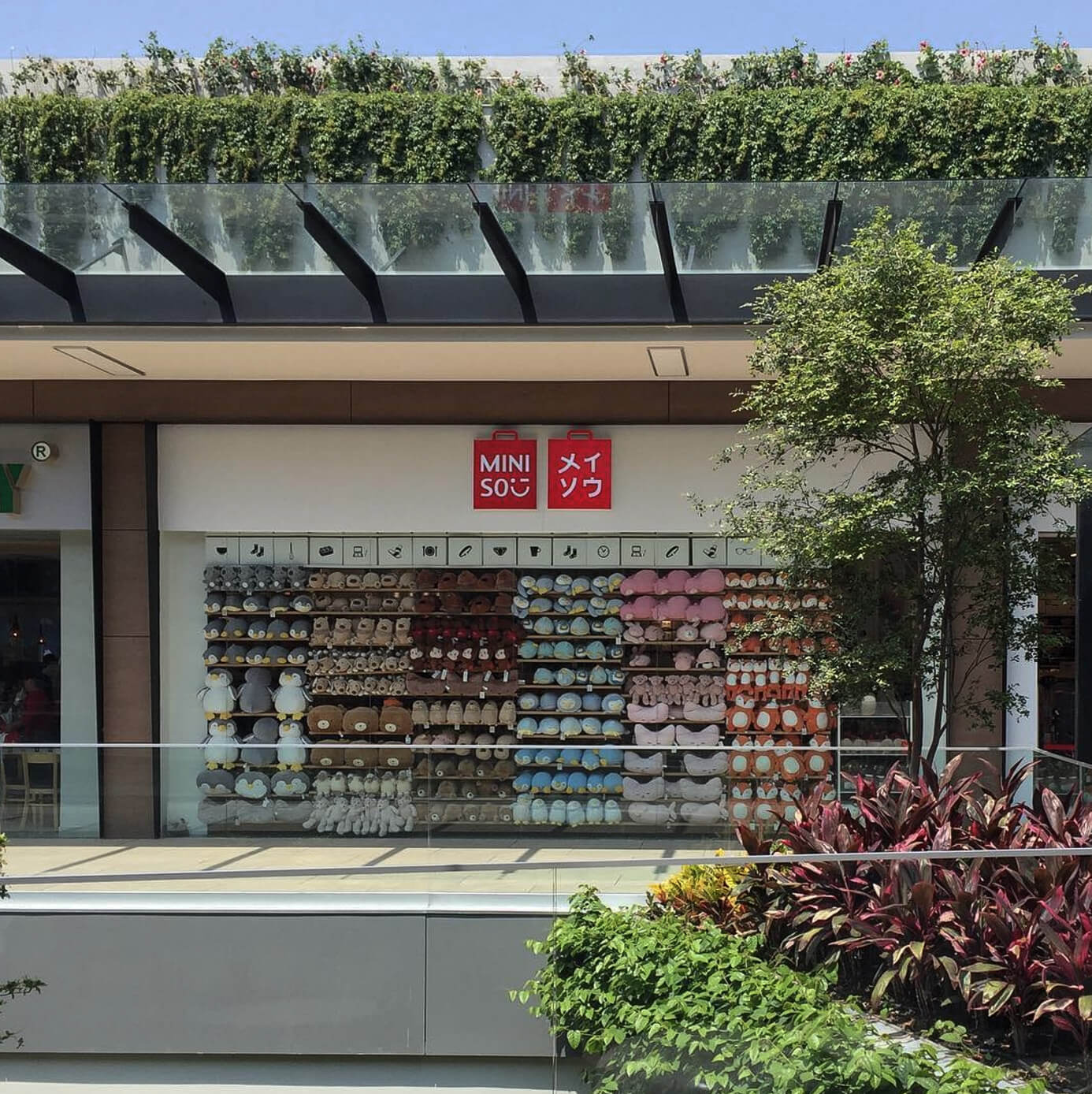 Modern glass building against a clear sky