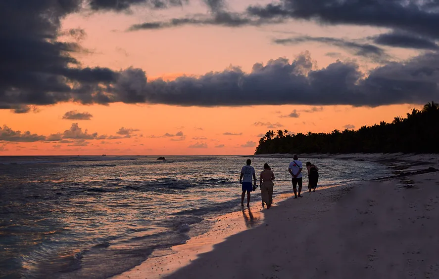 group of people setting up campfire