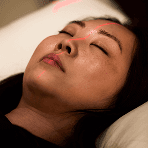 Close-up of a person during a wellness or recovery session at Biograph