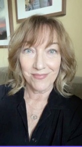 A happy customer smiling wearing orange headband