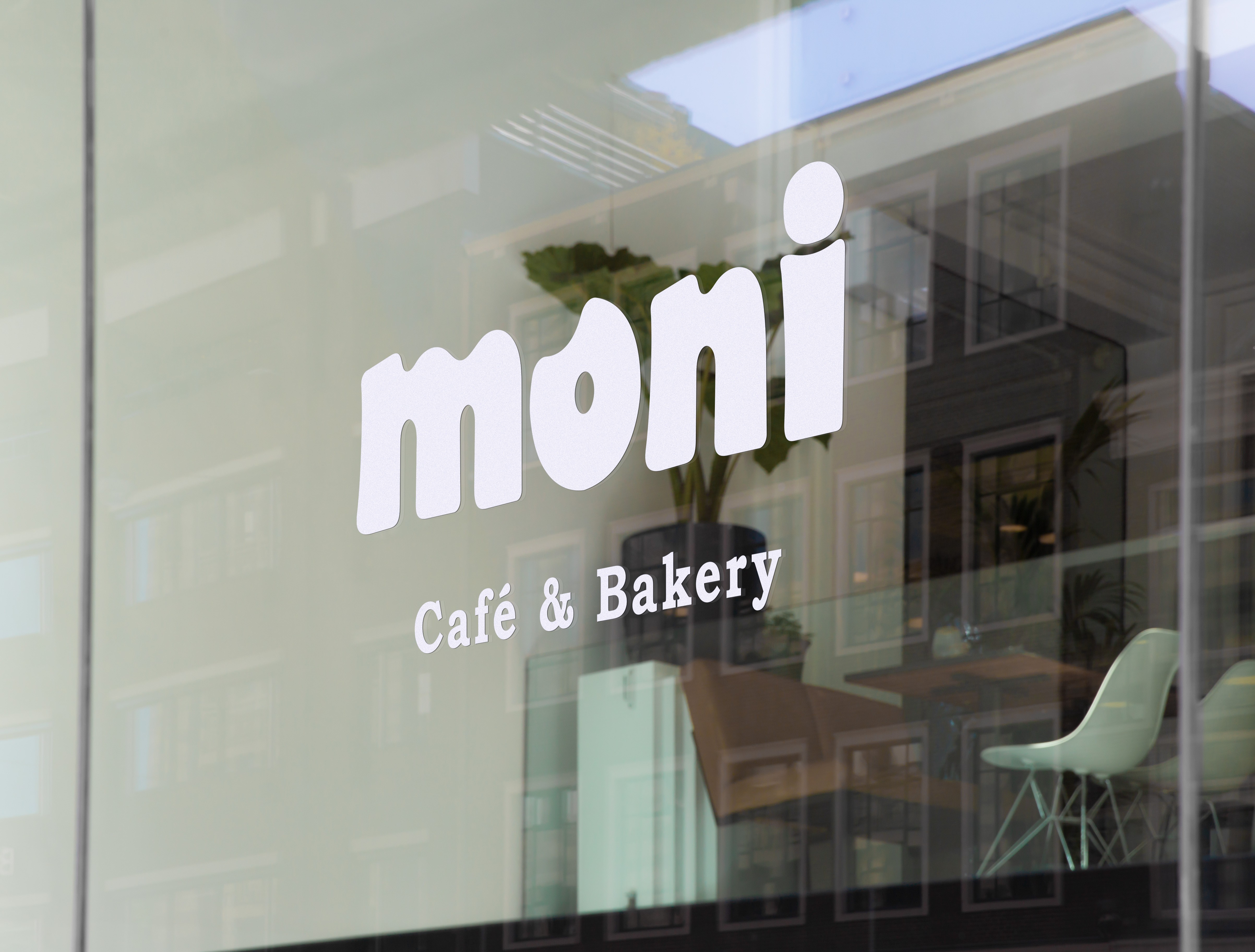 Cafe and Bakery Logo Applied On A Glass Panel, Moni