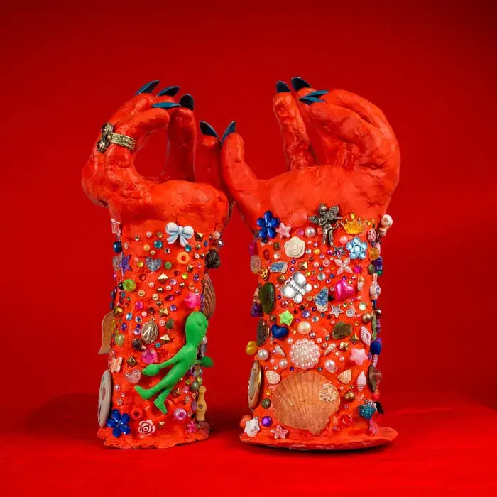 A modern brick house with a two-car garage, well-manicured lawn, and clear blue sky in the background.