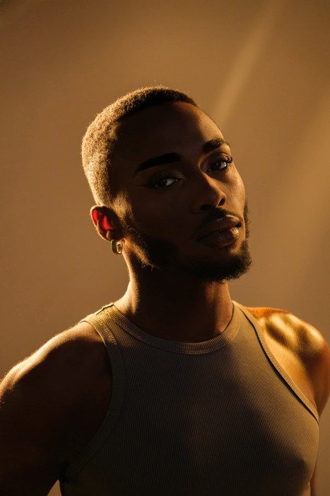 black male makeup artist creative portrait editorial moody style studio photoshoot