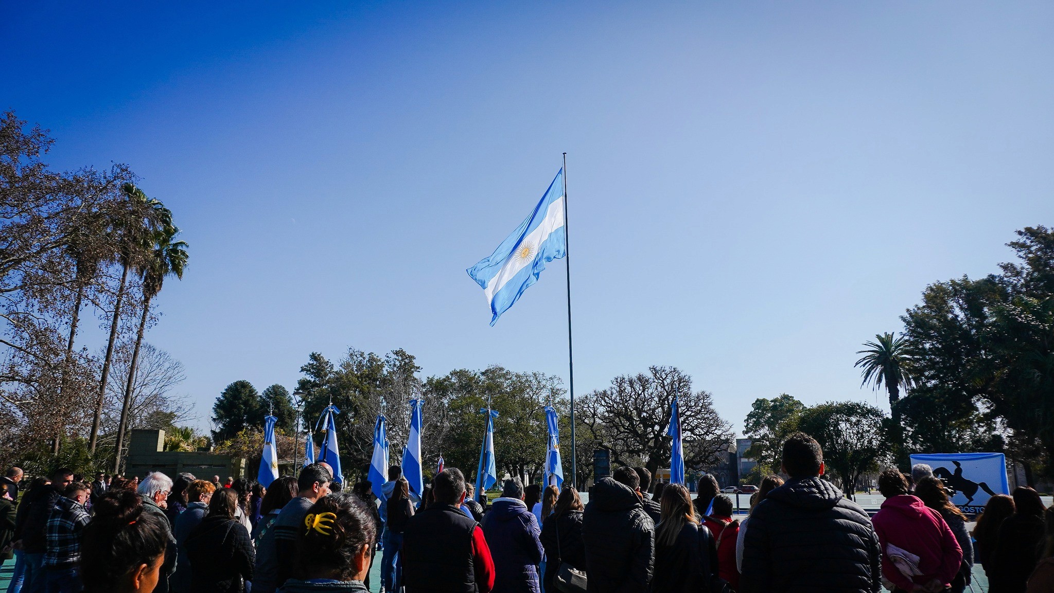 kids lying on a glass land and smiling