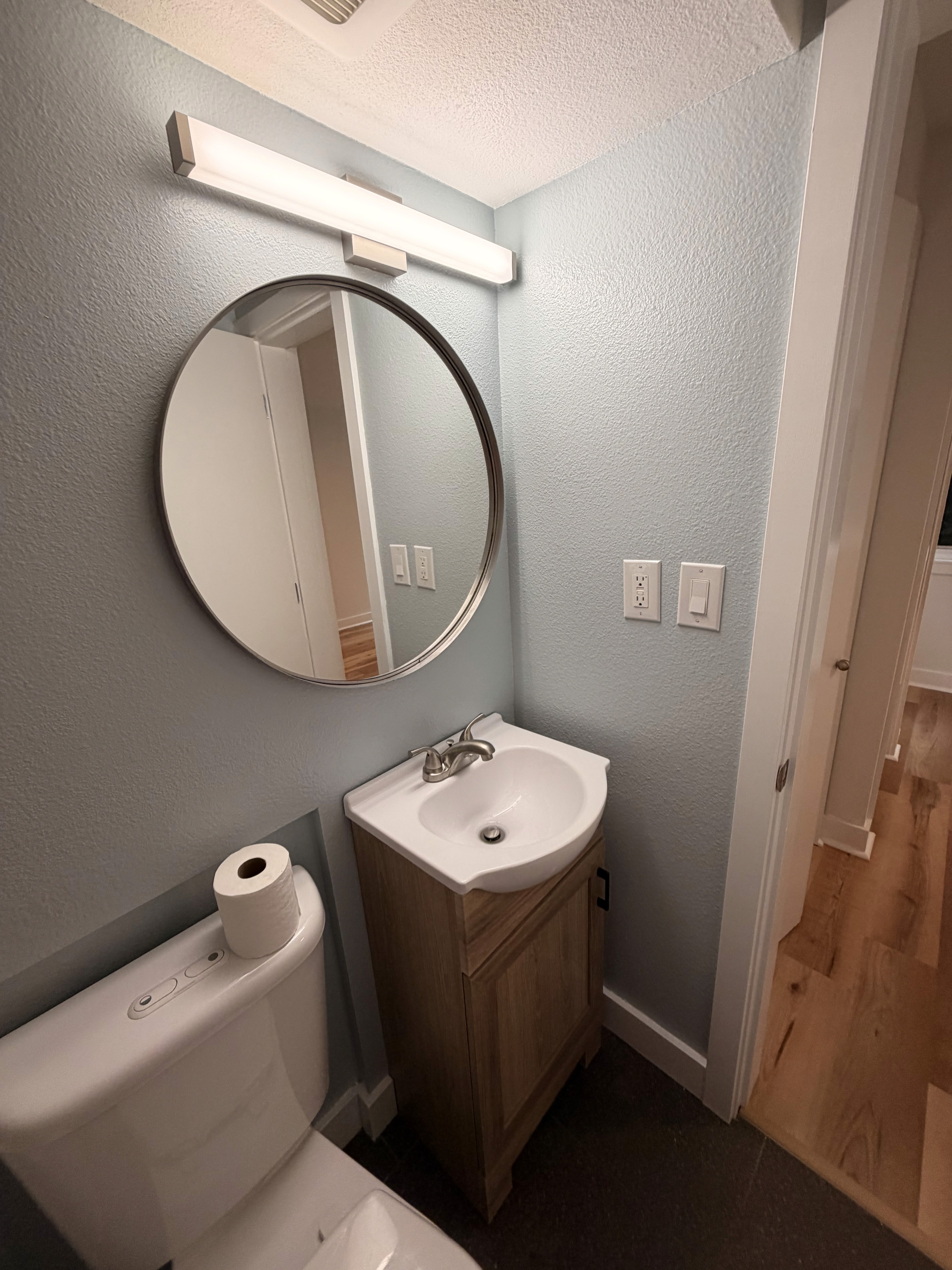 bathroom vanity and light fixture install in Seattle apartment