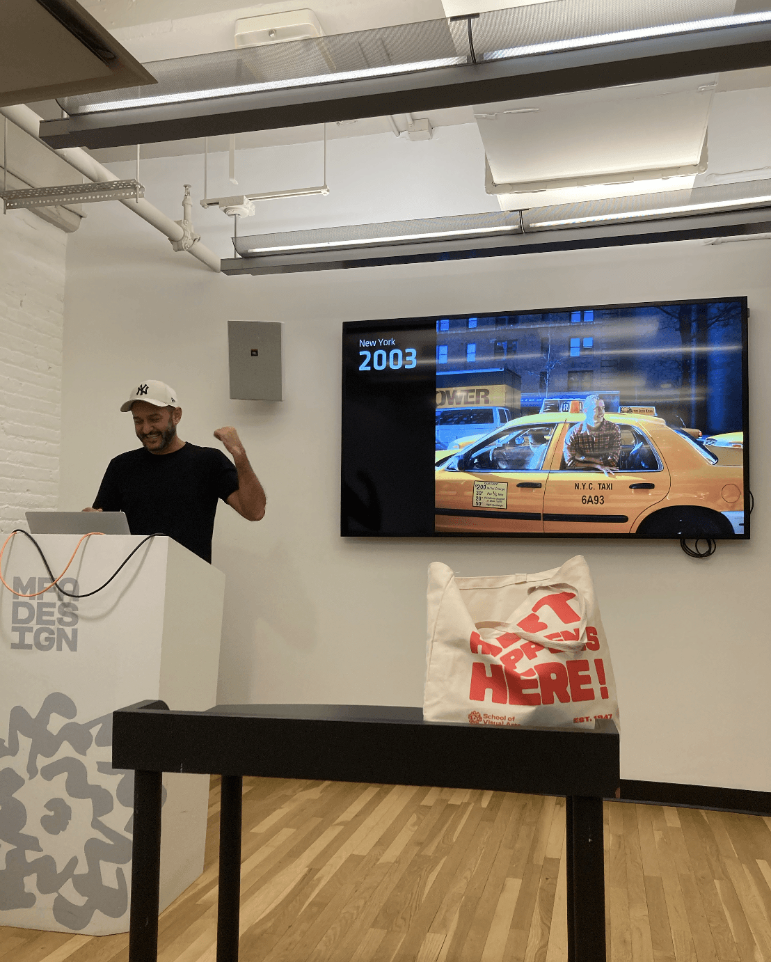 man lecturing a presentation