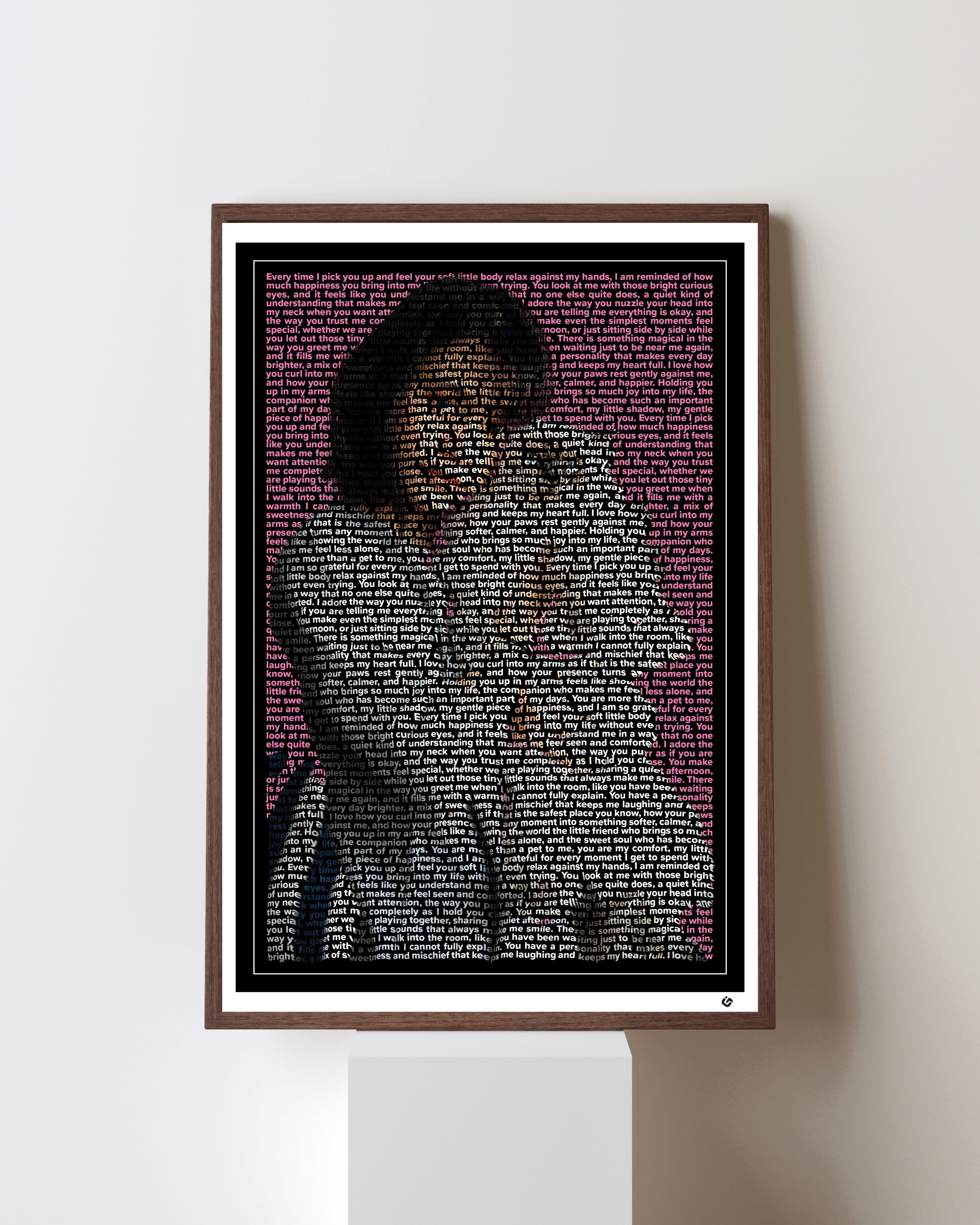 A custom text portrait of a girl holding her cat up gently, created using words of endearment. The girl holds her cat with affection while the cat relaxes in her hands, and the words forms their faces, hair, clothing, and fur in warm, blended tones. The artwork features a white mat border, a black inner frame, and a small corner logo. This personalized word art piece highlights the bond between a pet and its owner, the tenderness of companionship, and the signature U, Go Experience style that transforms meaningful stories into custom portraits.