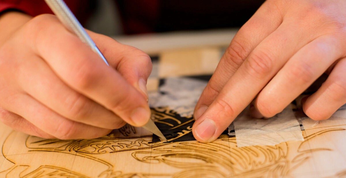 brown and white concrete house near green trees during daytime