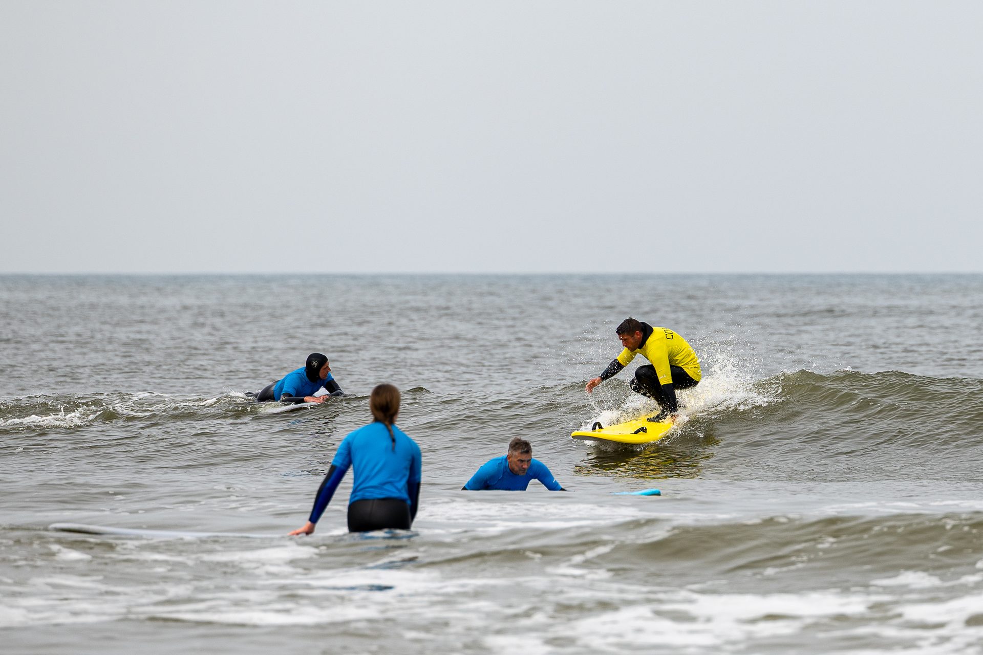 A man standing with Sufboard