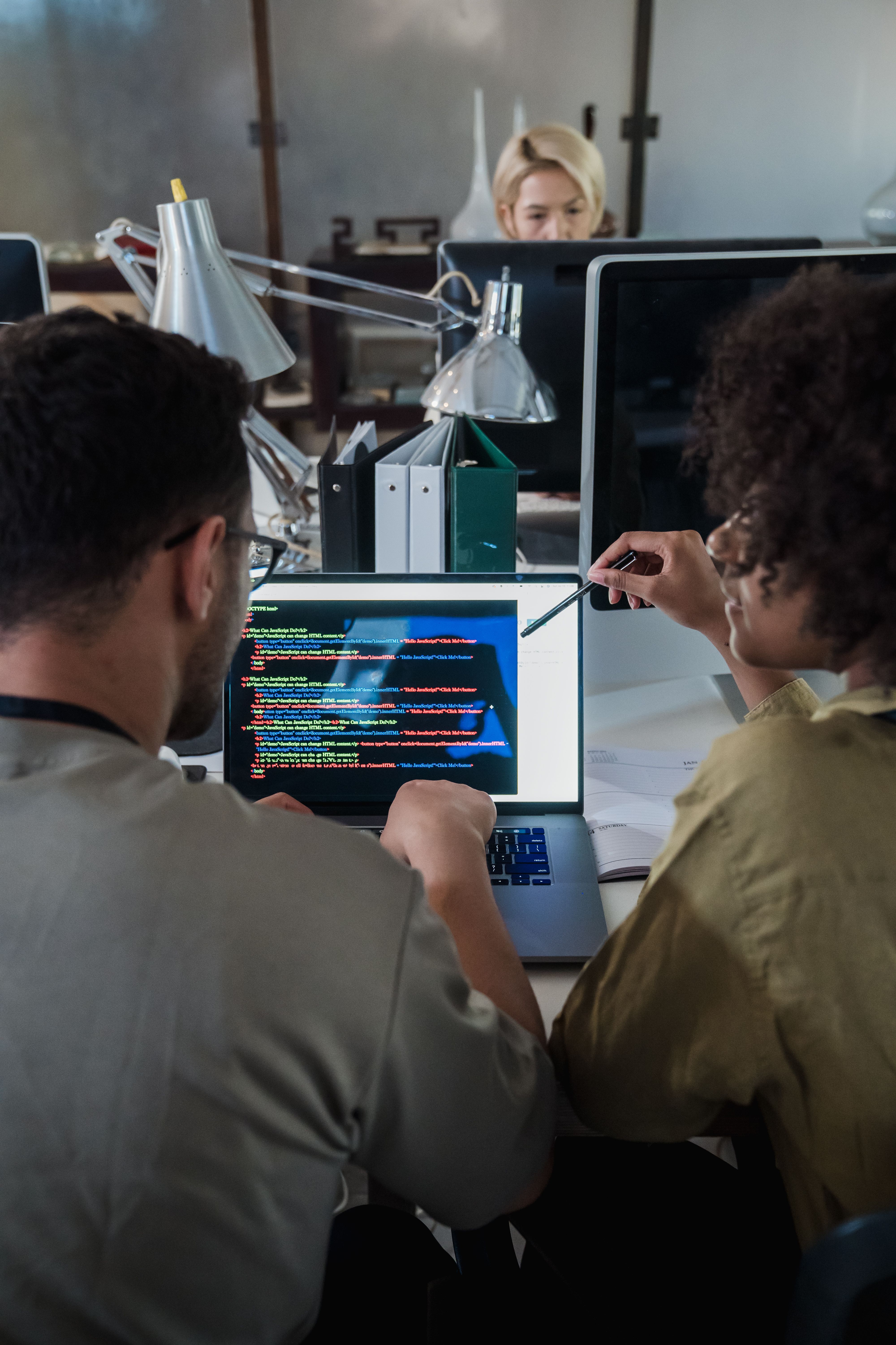 two-developers-engage-in-software-programming-on-a-laptop-in-a-modern-office-set - mizuno-k (pexels)