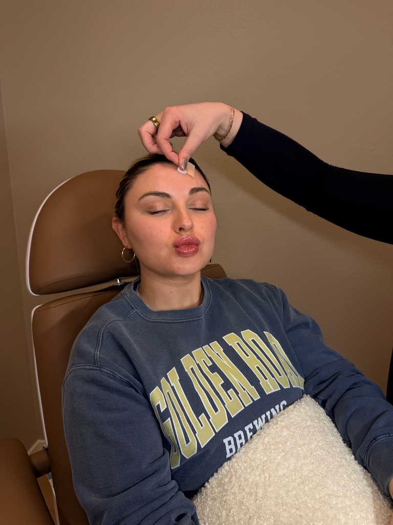 client receiving Botox treatment on forehead at The Dose Collective in Boise